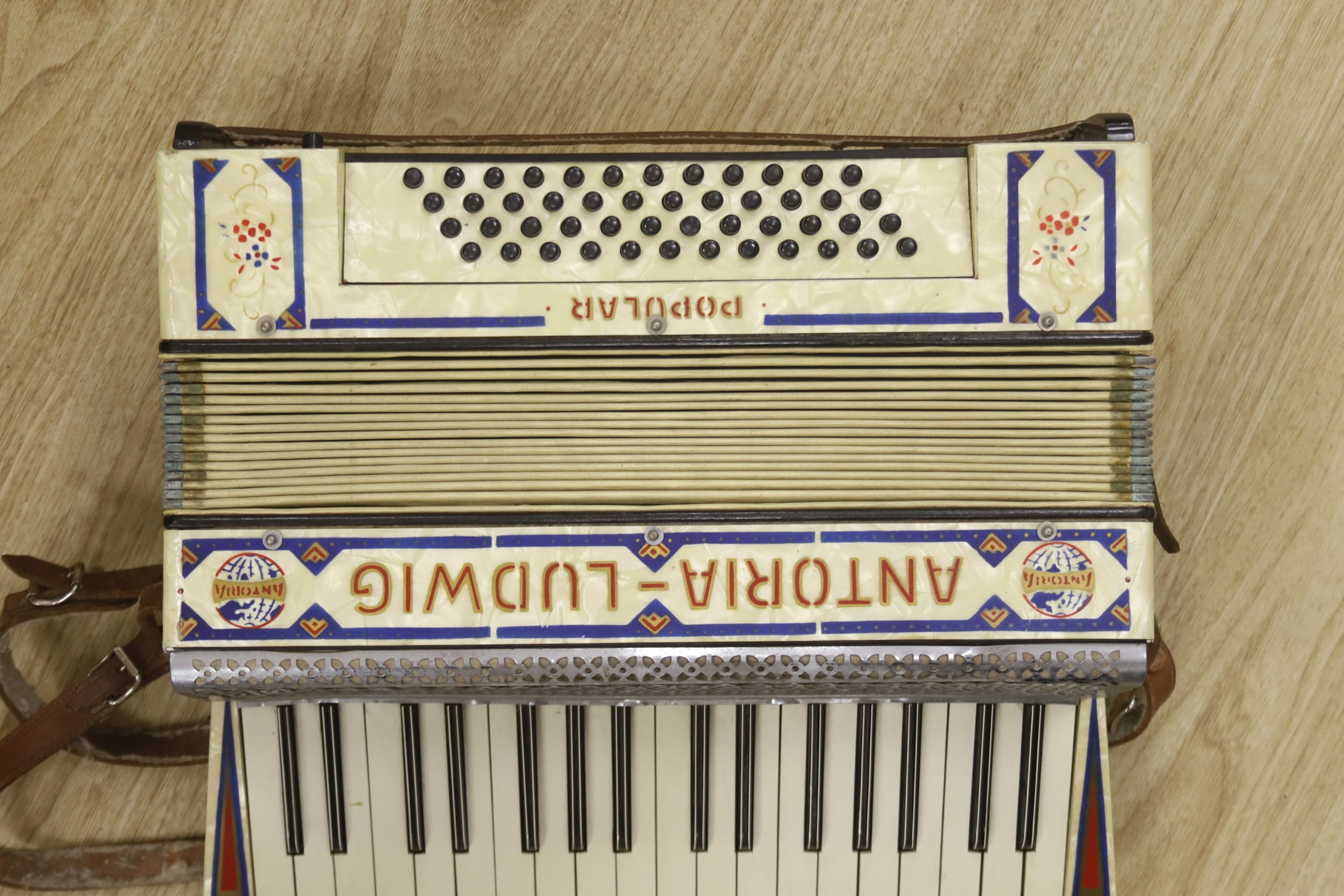A cased Antoria Ludwig accordian, cased